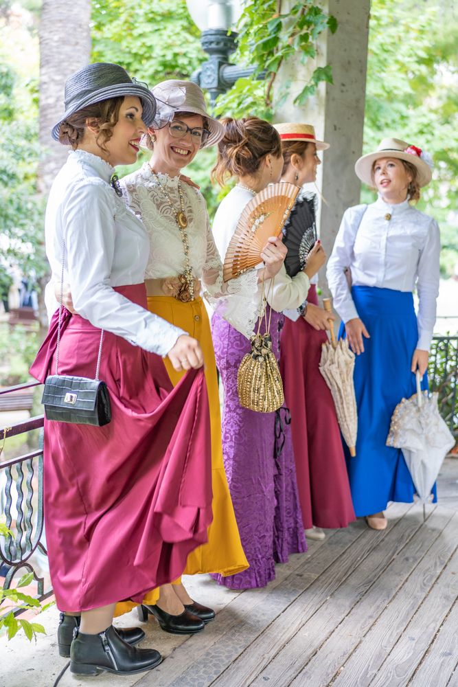 Vintage female friends speaking in garden