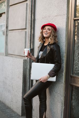 Woman with drink on the street