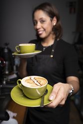 Latina woman with cappuccino cups