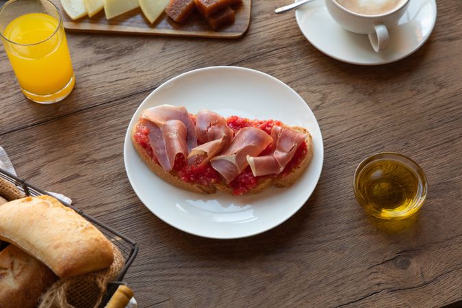 Stylish serving dishes with sandwich for breakfast