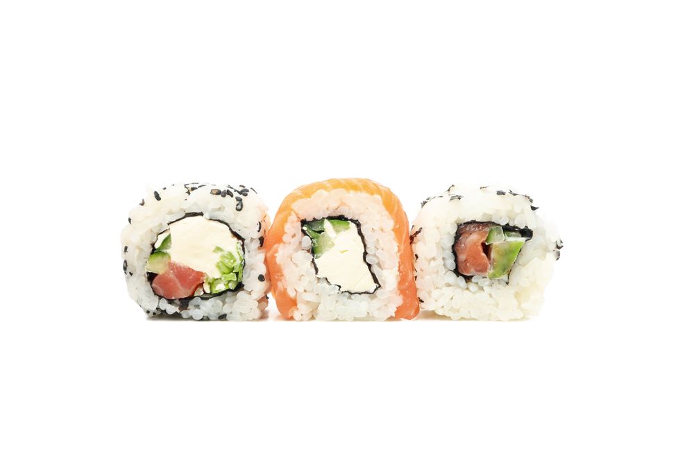 Japanese food. Delicious sushi rolls isolated on light background