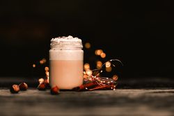Cinnamon near coffee on table