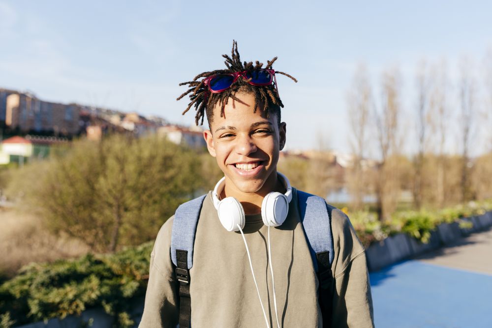Young Black smiling male looking at camera
