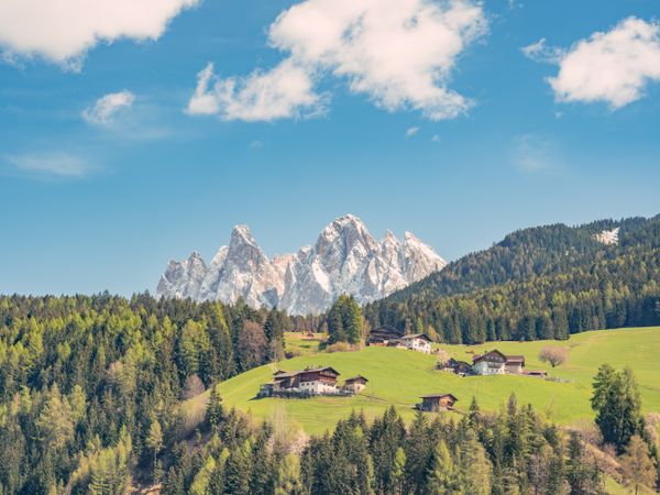Small beautiful village between mountains with snow