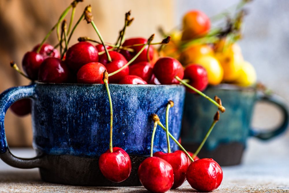 Summer cherries in big blue mug