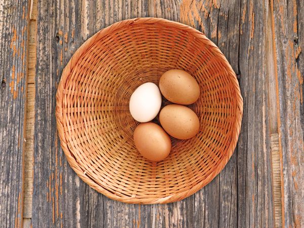 Eggs On The Wooden Background