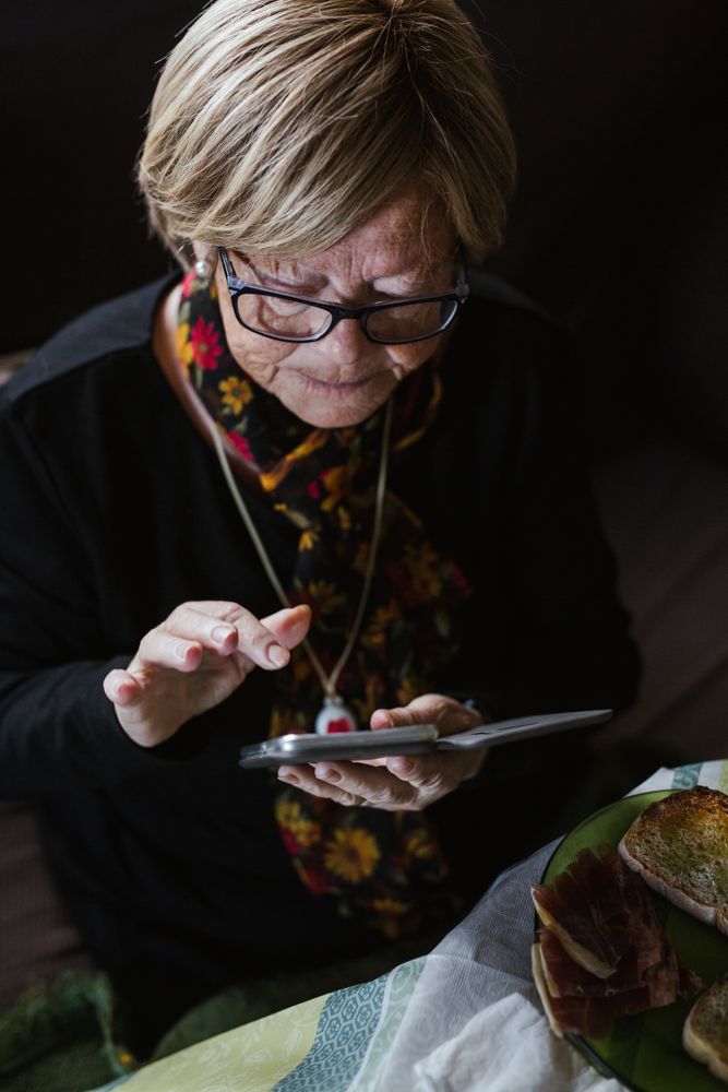 Mature woman looking in smartphone