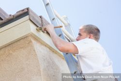 Professional Painter Using A Brush to Paint House Fascia 4d8rkQ