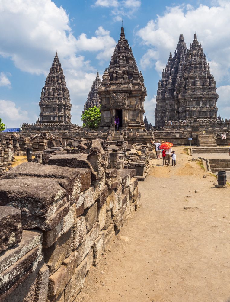 Sulawesi Island, Indonesia - August, 15 2015: Tourists near old temple on cloudy day