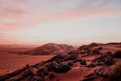 Sunset sky over hills in desert