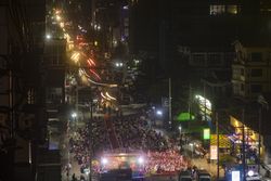 Mandalay, Myanmar - December 29, 2019: Crowded Buddhist religious event on 77th Street