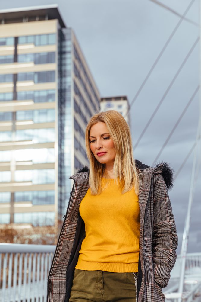 Blonde woman walking in the city