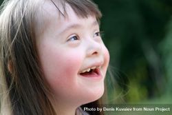 Closeup of a young brunette girl with an intellectual disability 5QPpm0