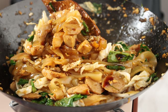 Close Up Making Kwetiaw or Chinese Char Kway Teow, Rice Flat Noodle