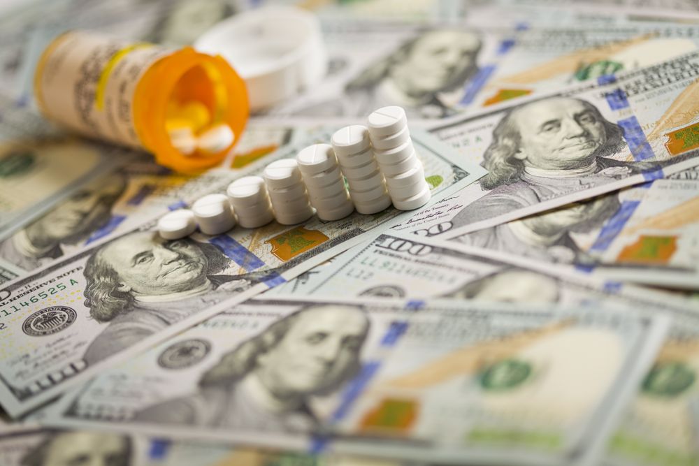 Medicine Pills Stacked on Newly Designed One Hundred Dollar Bills