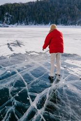 Woman skating on frozen river