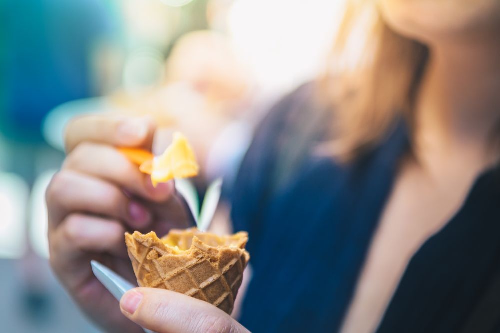 Woman eating ice cream in close-up