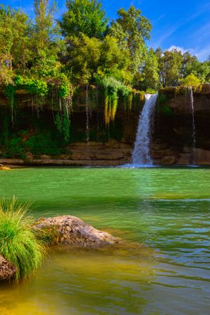 View of beautiful waterfall and lake