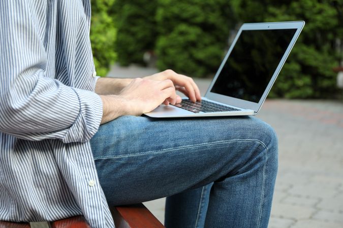 Young student working in a laptop outdoor. Study. University