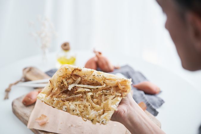 Anonymous person with onion tart