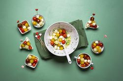 Summer salad with tomatoes and mozzarella eaten