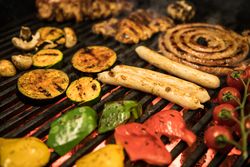 Vegetables and meat on grill