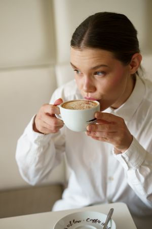 Woman sipping coffee