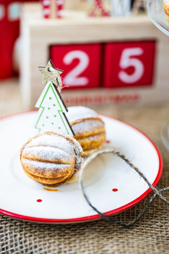 Holiday dessert cookies stuffed with caramel cream surrounded by ornaments