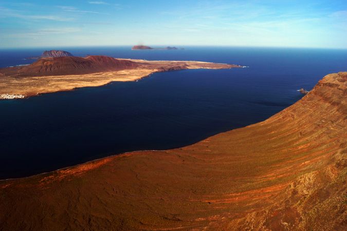 Magnificent islands in serene sea under blue sky