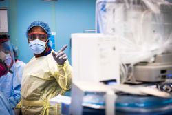 New York, NY, USA - April 17, 2020:  U.S. Navy nurse, monitors a patient’s vitals on USNS Comfort