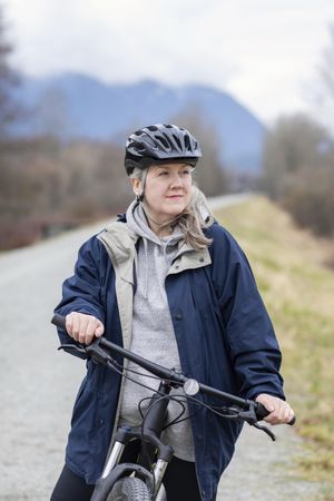 Woman taking a break during a bicycle ride