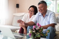 Grandpa and Grandma on a video call on laptop to say hello.