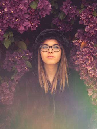 Woman on background of stunning violet flowers
