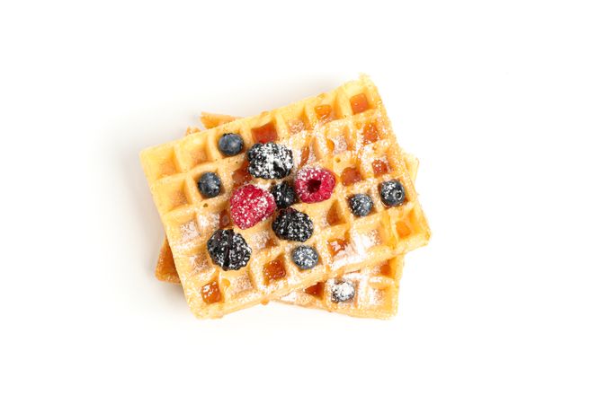 Waffles with caramel topping isolated on blank background
