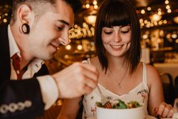 Young couple eating salad on date
