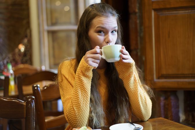 Cozy Caf Moment Young Woman Enjoying Tea