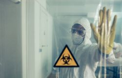 Male doctor prohibiting access to a restricted area