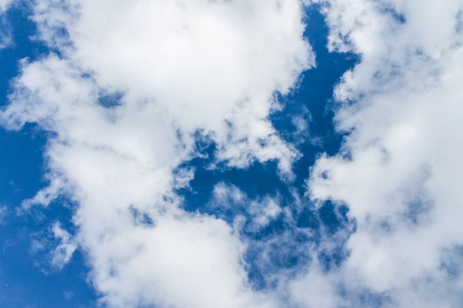 Rounded clouds in blue sky