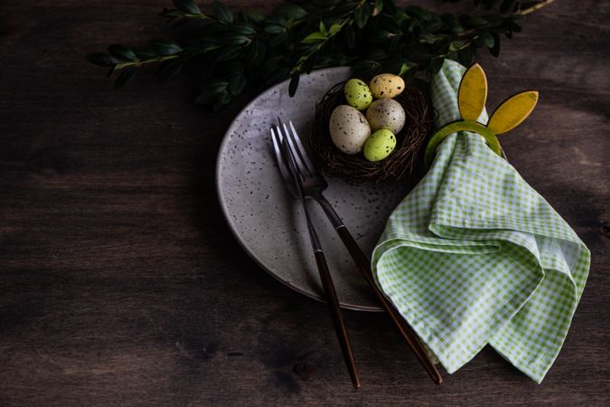 Spring table setting with nest, eggs and rabbit napkin ring