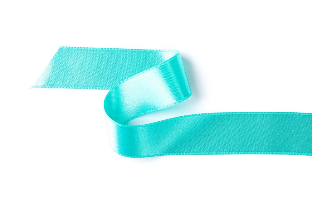 Turquoise ribbon isolated on plain background. Gift concept