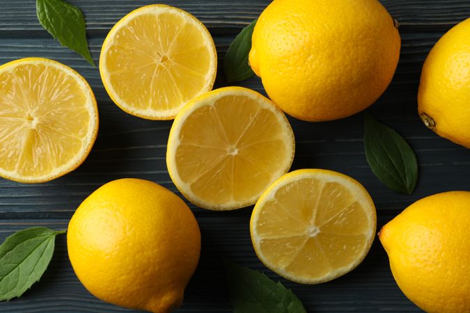 Fresh lemons on wooden background, top view. Ripe fruit