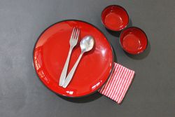 Table setting with red plates