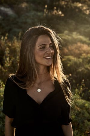 Cheerful woman looking away