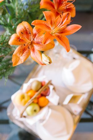Bouquet and tray on table in hotel room