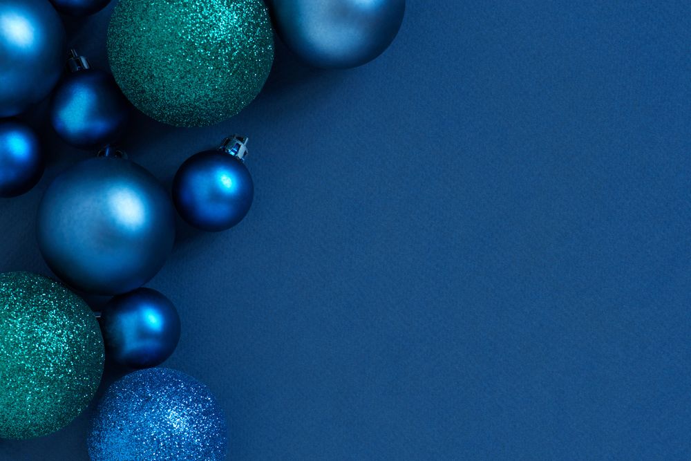 Blue holiday baubles with copy space