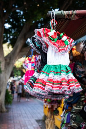 Traditional Mexican dresses for girls at market stand