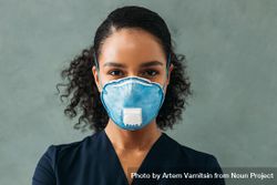 Black female medical professional in protective face mask on grey background 0VYLOb