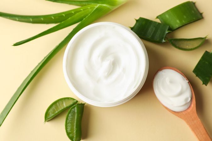 Composition with natural treatment accessories on color background, closeup. Aloe vera