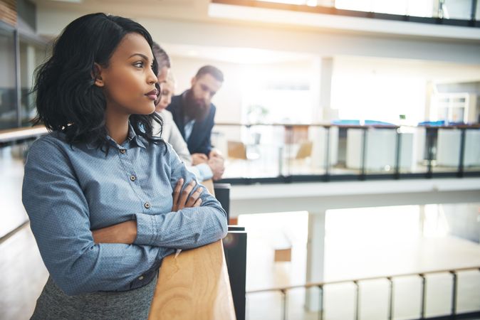 Pensive Black business woman pictured deep in thought