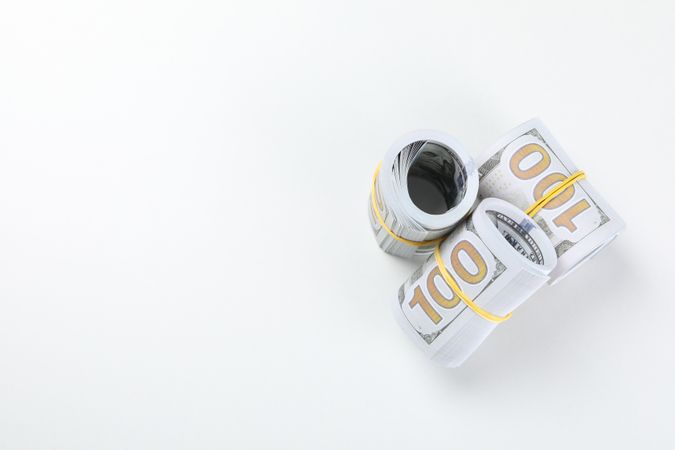 Stacks of American cash money on light background, space for text